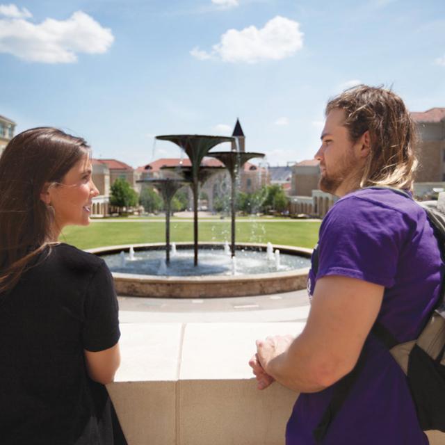 students with Frog Fountain in the background